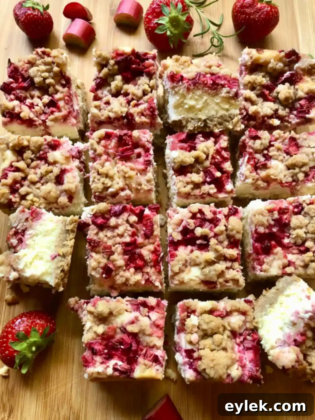 Strawberry Rhubarb Cheesecake Bars 27 Delicious Strawberry Rhubarb Cheesecake Squares ready to be devoured.