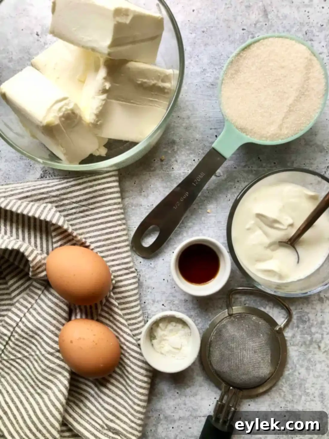Ingredients for the creamy cheesecake layer: cream cheese, sugar, sour cream, heavy cream, vanilla, eggs, starch.