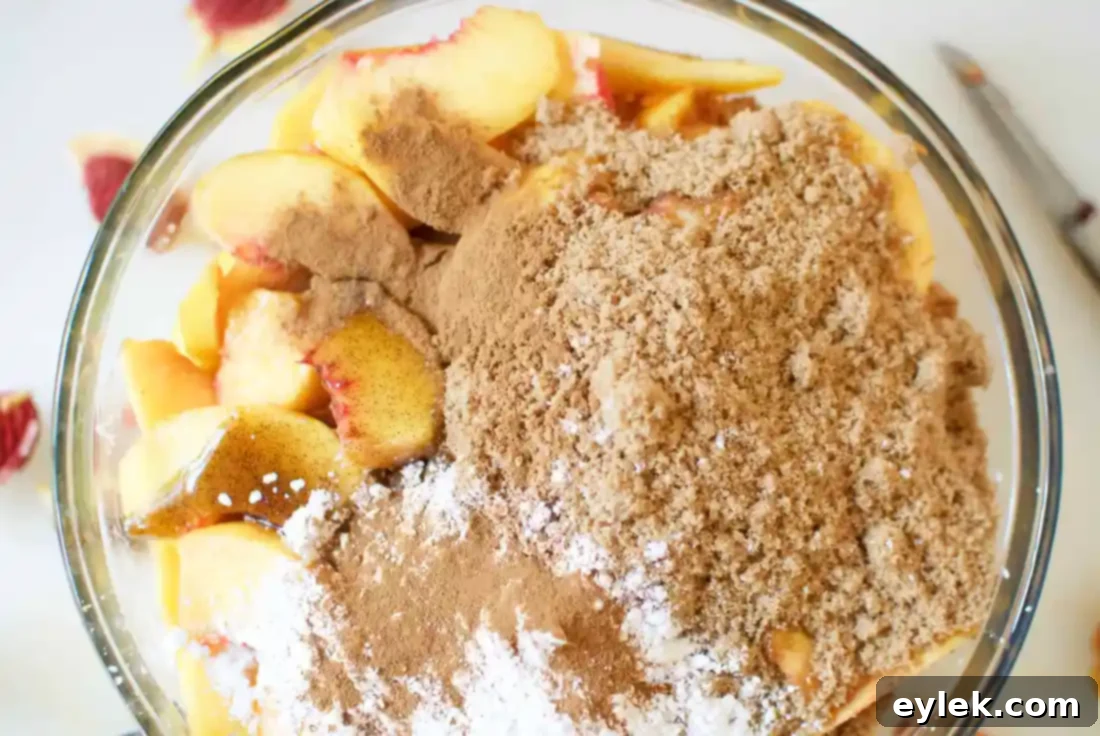Mixed peach filling in a large pot.