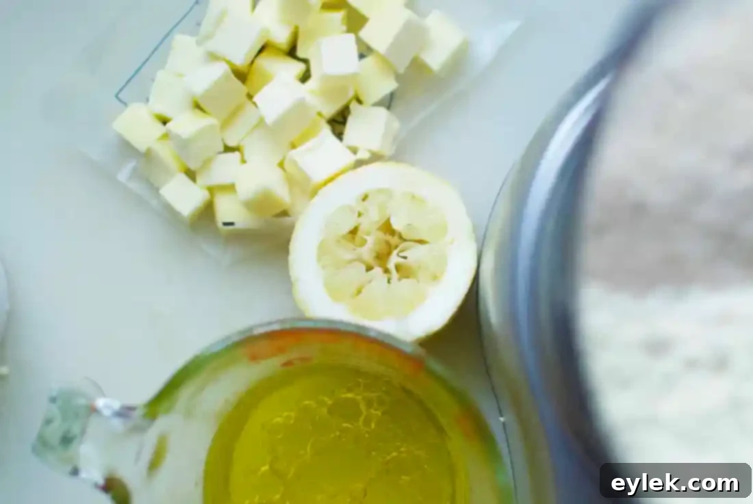 Preparing pie dough in a food processor, showing flour and butter mixture.
