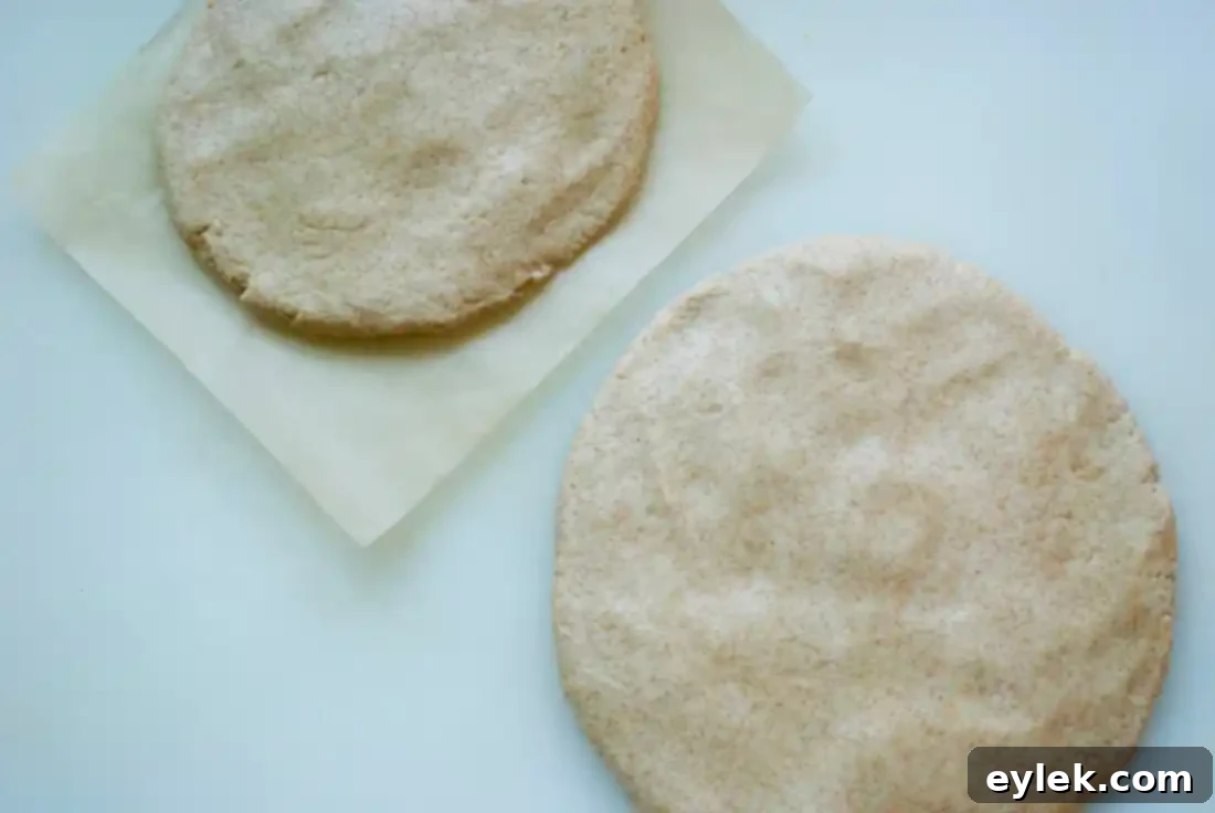 Plastic-wrapped dough disks chilling in the refrigerator.