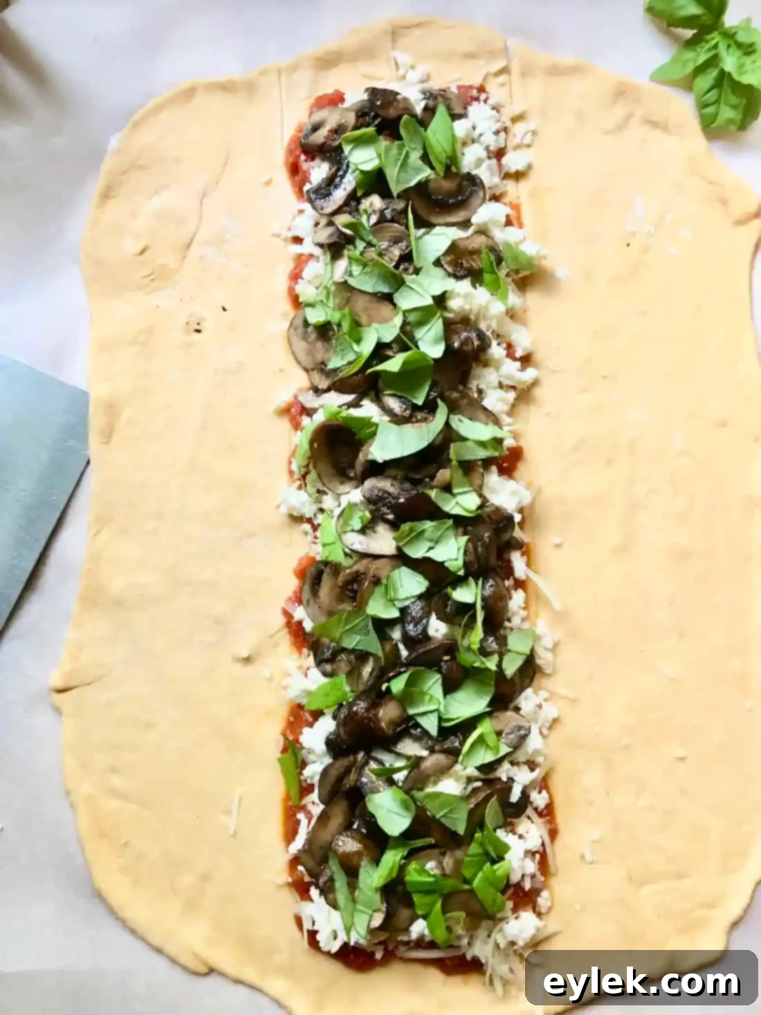 Dough with folded ends and filling ready for braiding