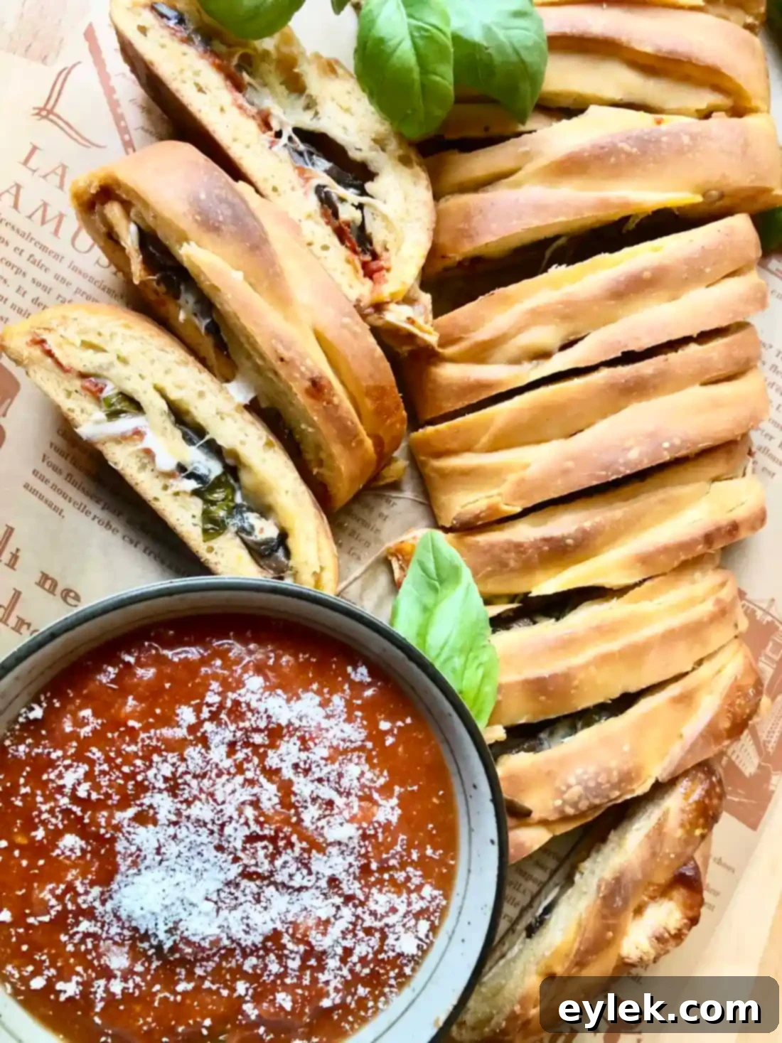 Close-up of a slice of Pizza Braid with Basil & Mushrooms