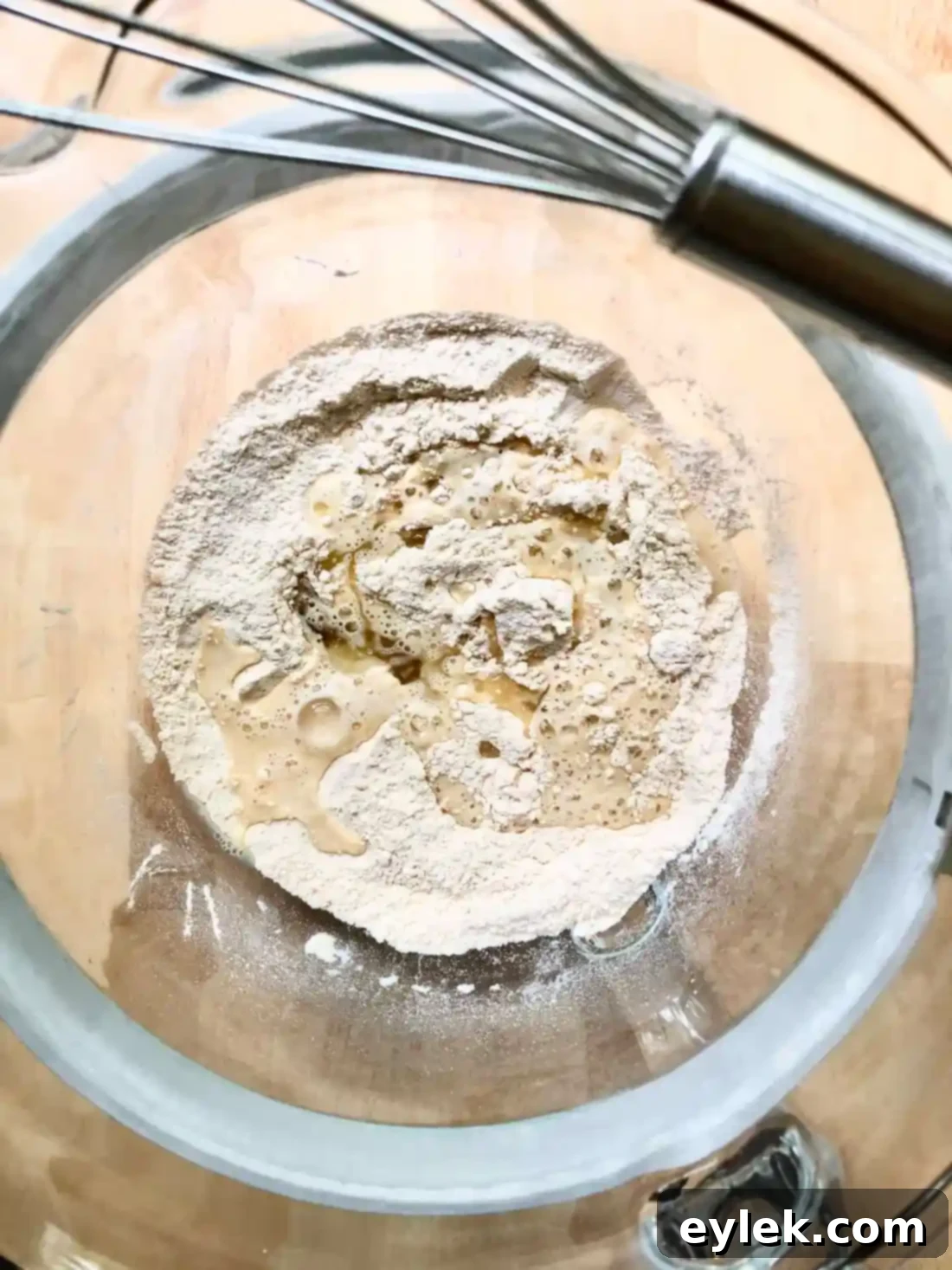 Adding olive oil and water to dry ingredients