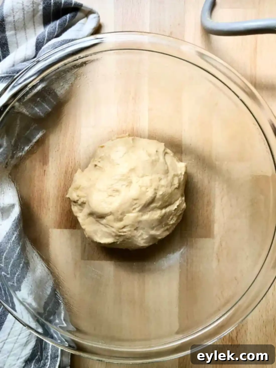 Pizza dough rising in a bowl