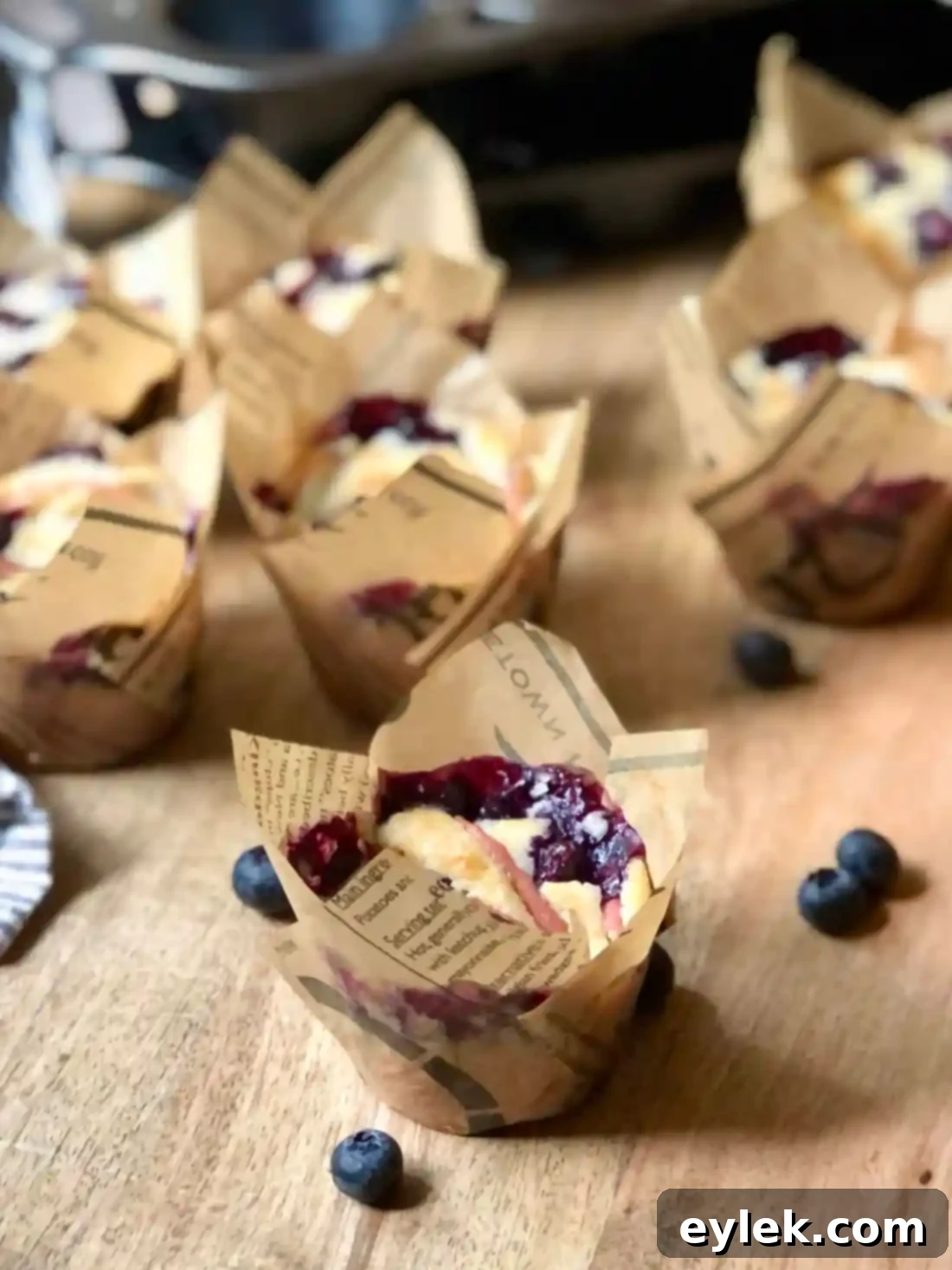 Multiple fluffy apple blueberry cupcakes