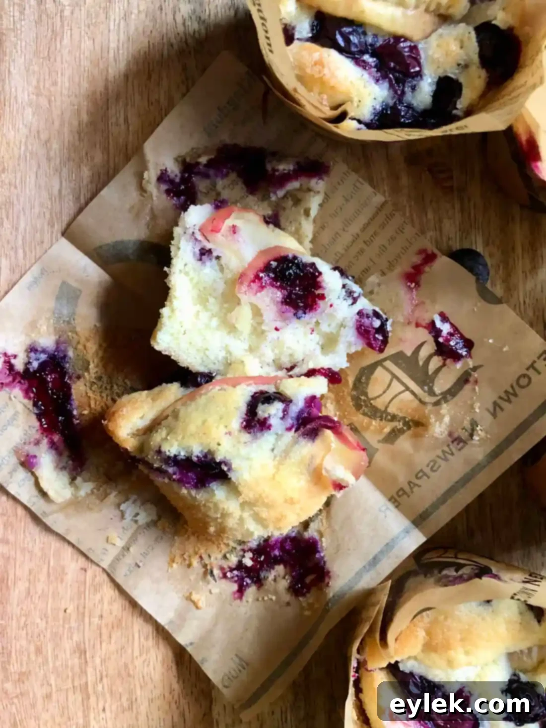 A single fluffy apple blueberry cupcake