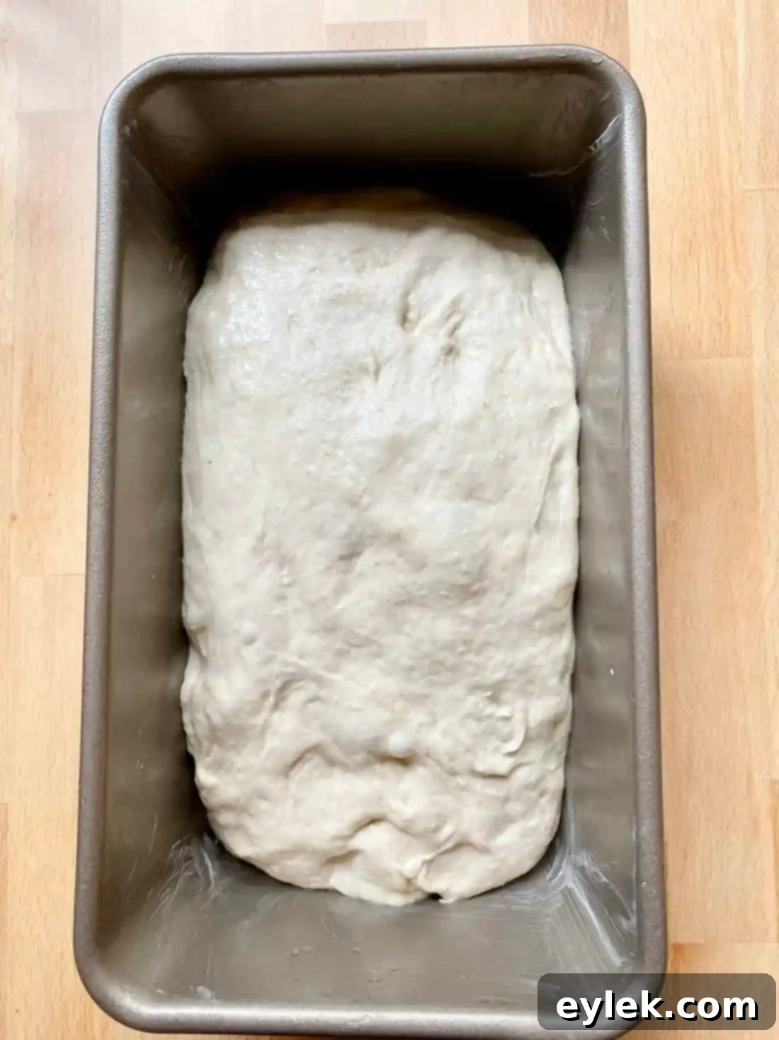 Never-Fail Sandwich Bread - Dough being transferred to pan