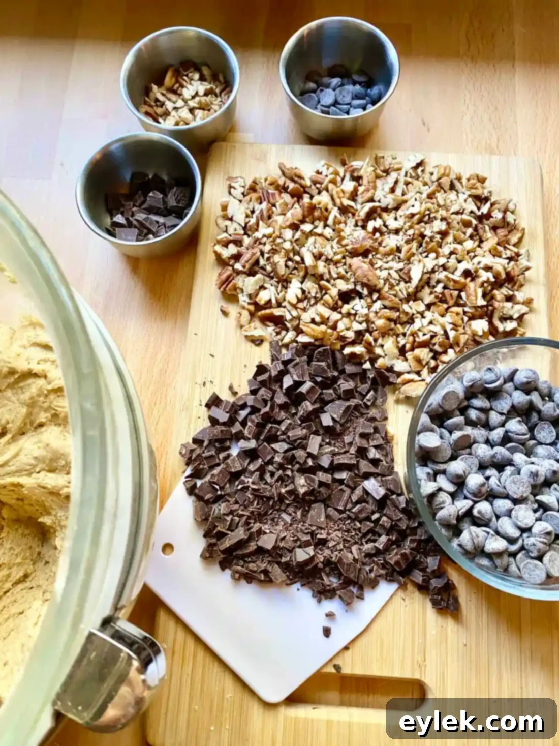 Adding dry ingredients to pumpkin cookie dough