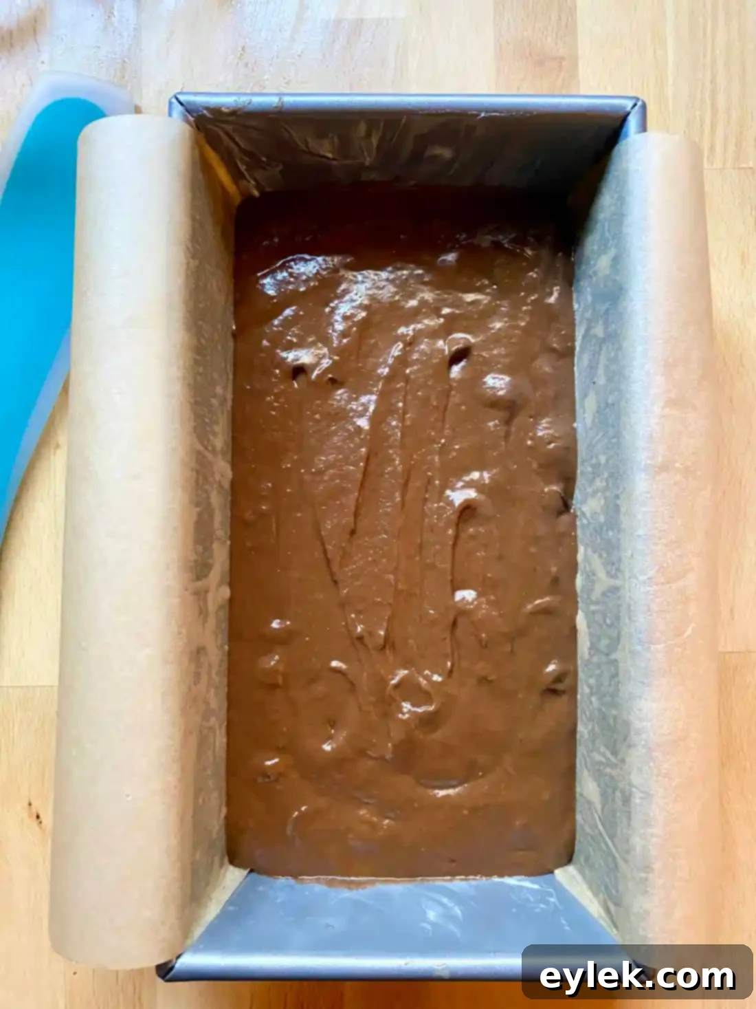 Smooth cake batter in loaf pan