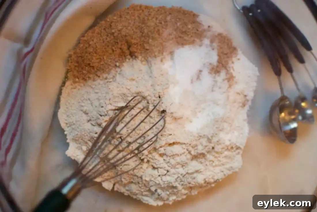 Muffin batter divided into bowls, ready for various flavorful additions.