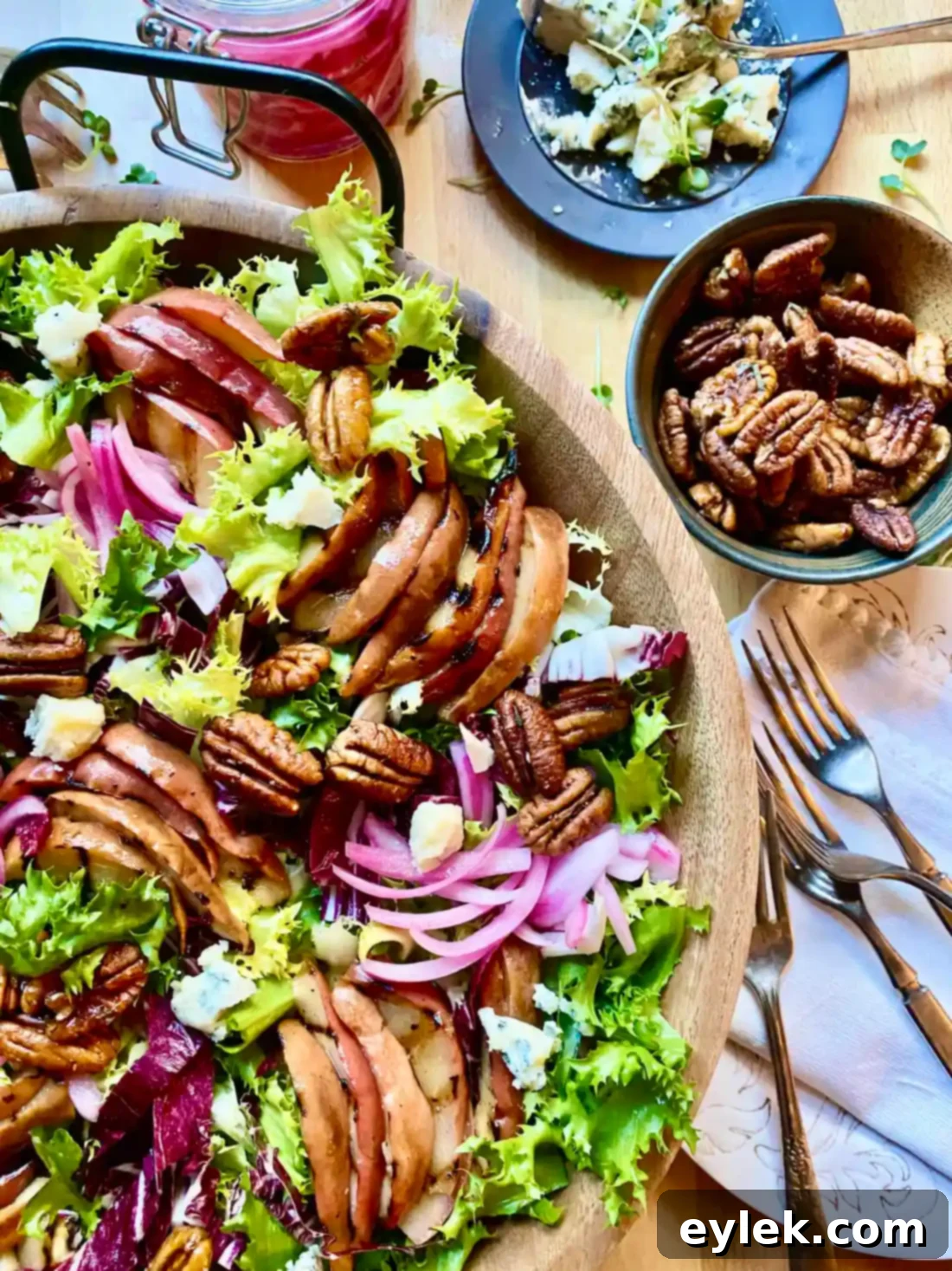Assembling Chicory Salad with Grilled Pears and other toppings