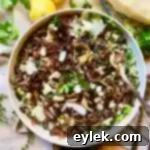 Herby Barley Salad with Buttery Mushrooms, artfully arranged and garnished, ready to eat
