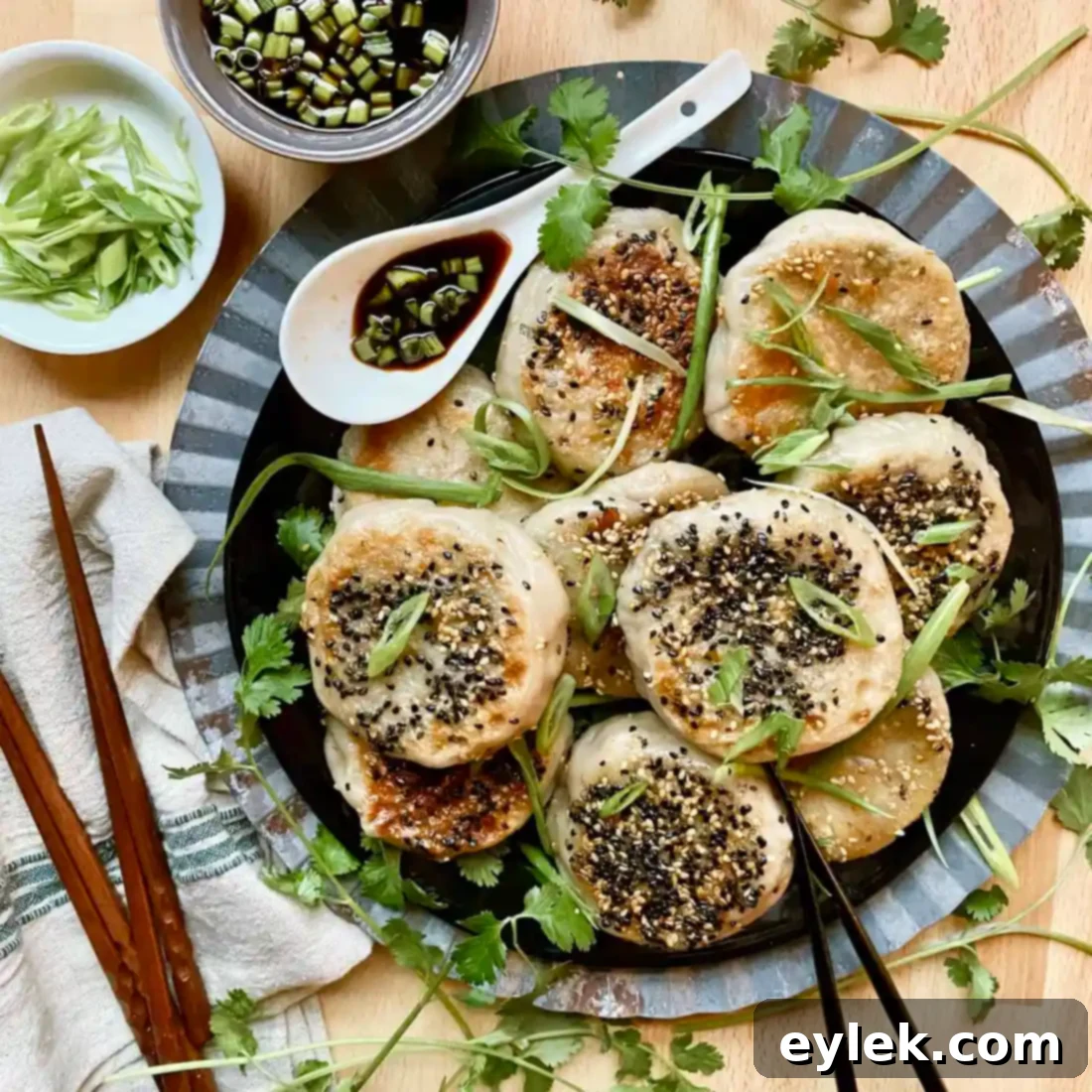 Steamed Crispy-Bottom Veggie Buns - Plated with Sauce