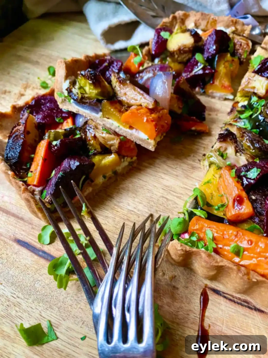 Savory Harvest Vegetable Tart on a wooden board