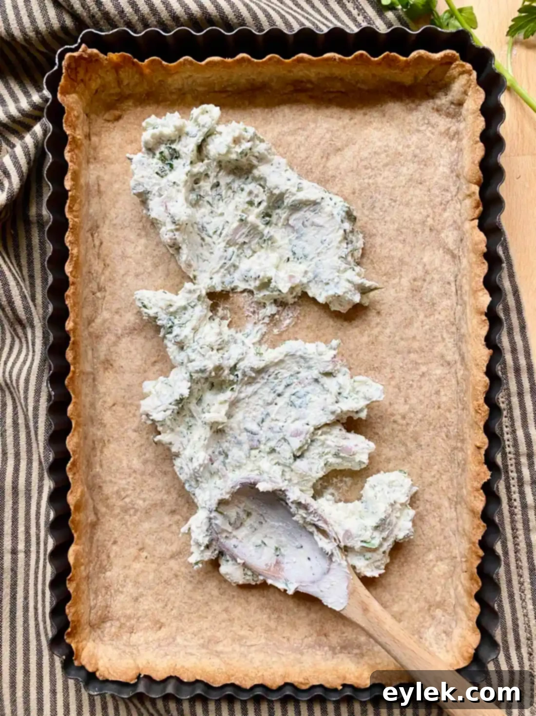 Mixing cheese, herbs, and shallots