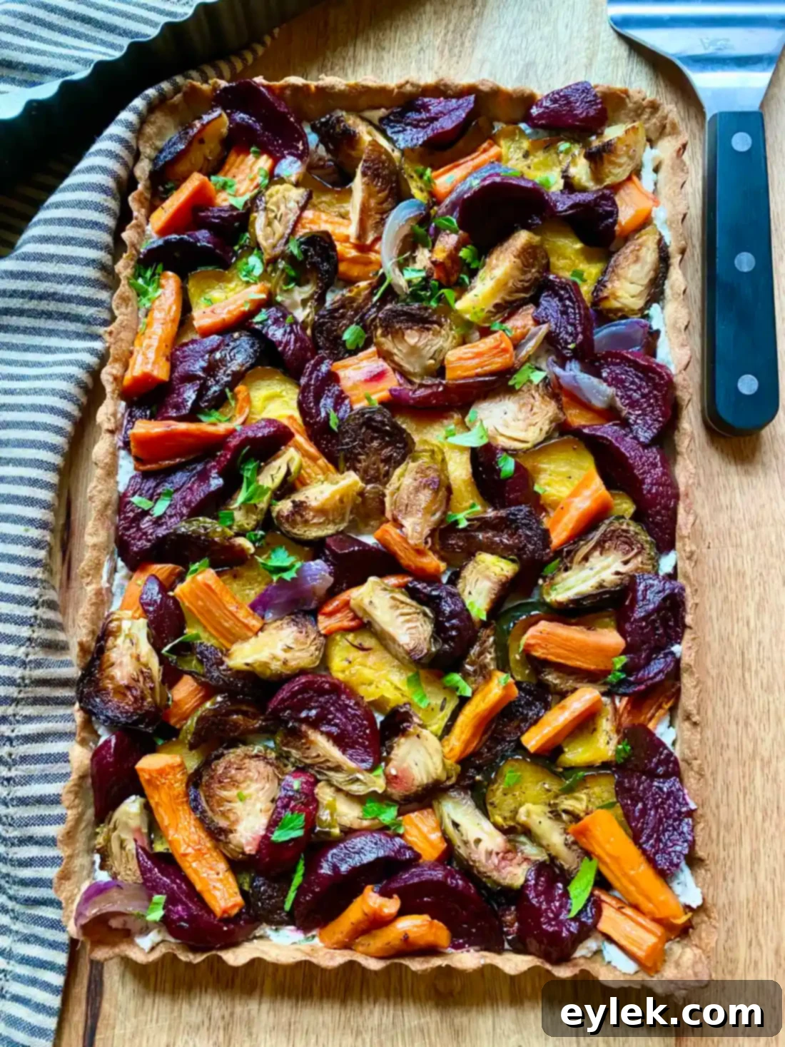 Savory Harvest Vegetable Tart garnished with parsley