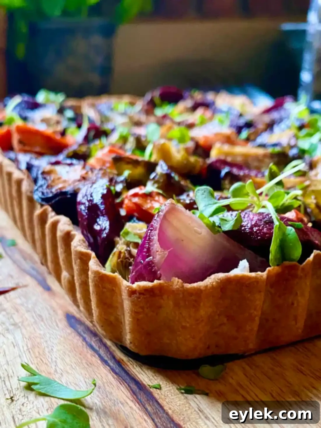 Close-up of a slice of Savory Harvest Vegetable Tart