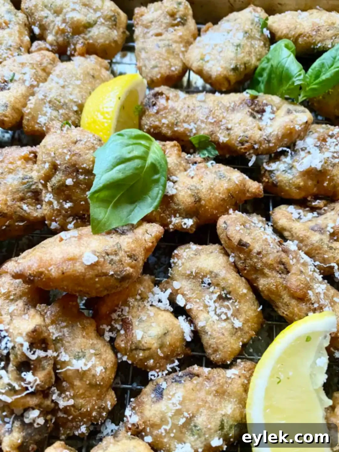 Crispy fried artichoke hearts on a wire rack
