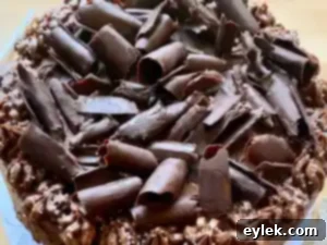 Spreading melted chocolate on baking sheet