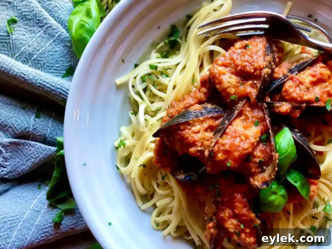 Homemade Stuffed Mussels Marinara on pasta