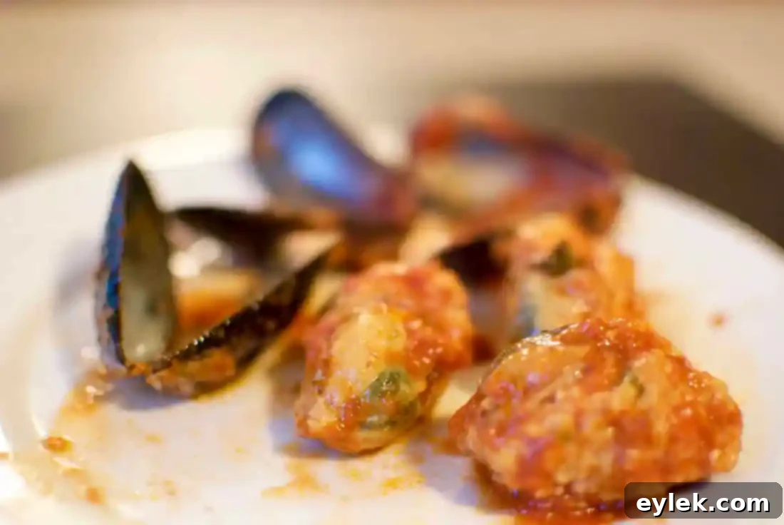 Homemade Stuffed Mussels Marinara with bread