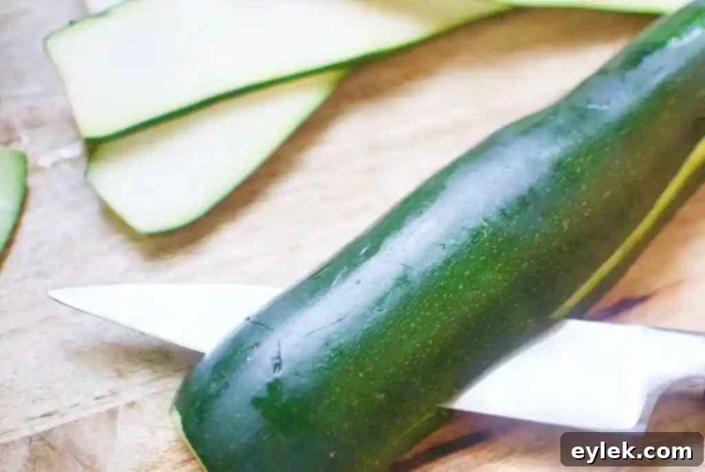 Zucchini being sliced for involtini preparation