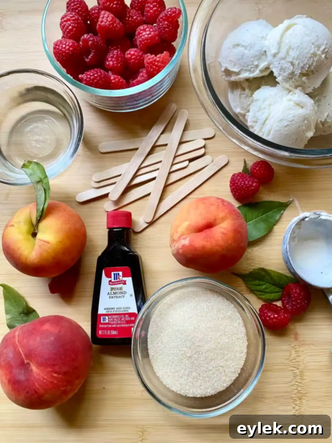 Homemade Peach Melba Popsicles with raspberries and peaches