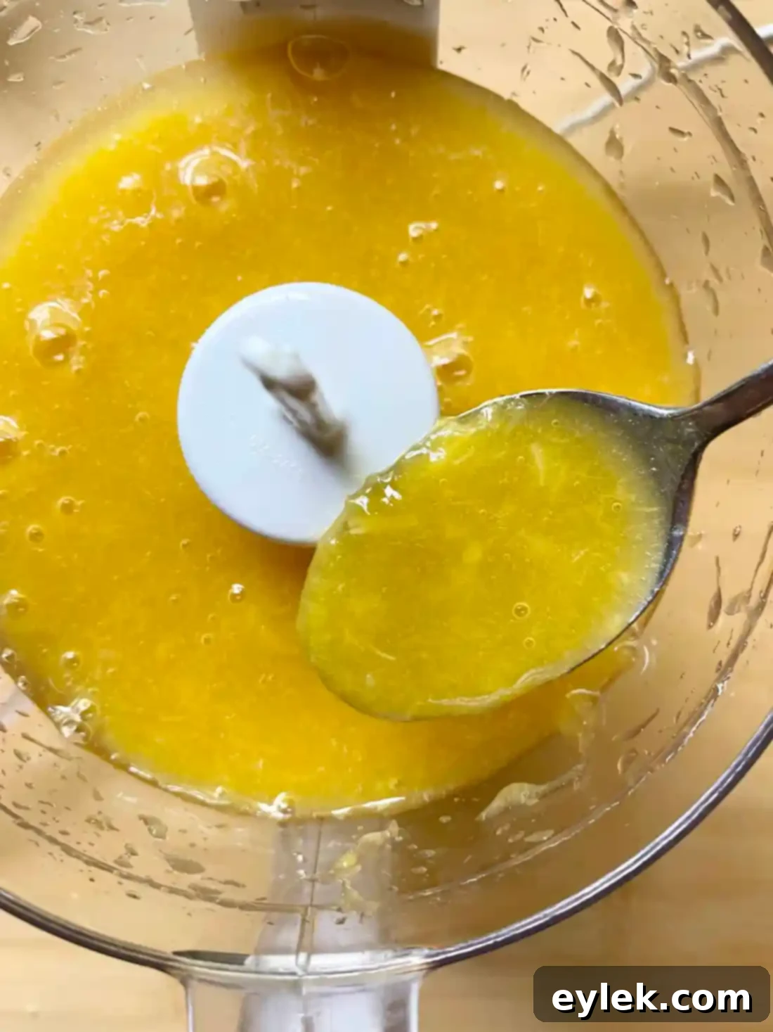 Smooth peach puree in a measuring cup