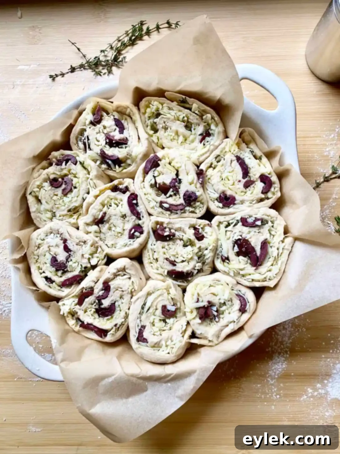 Olive Cheese Bread Swirls 12 Arranging pinwheels in baking dish