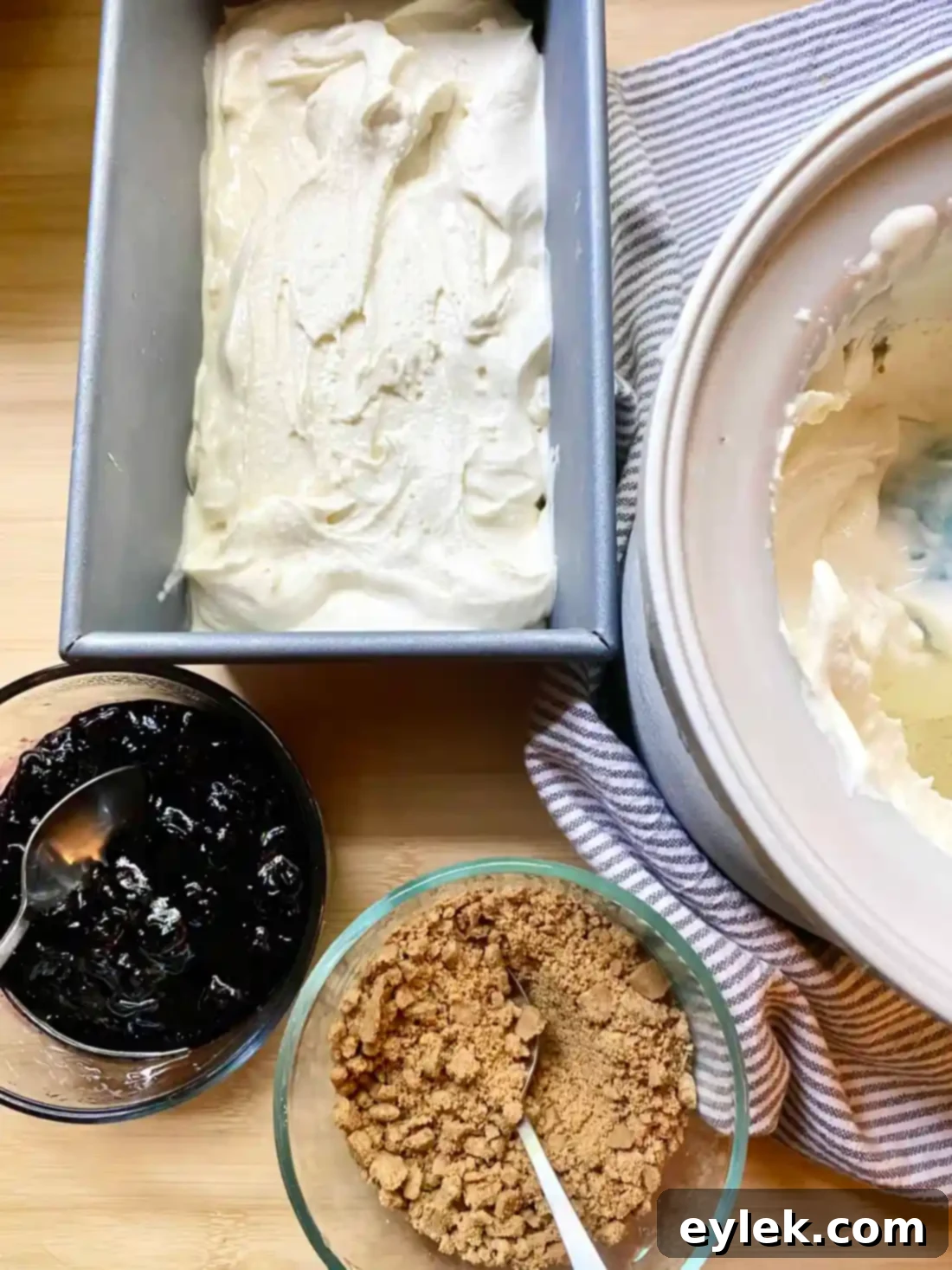 Layering ice cream, blueberry sauce, and graham crackers