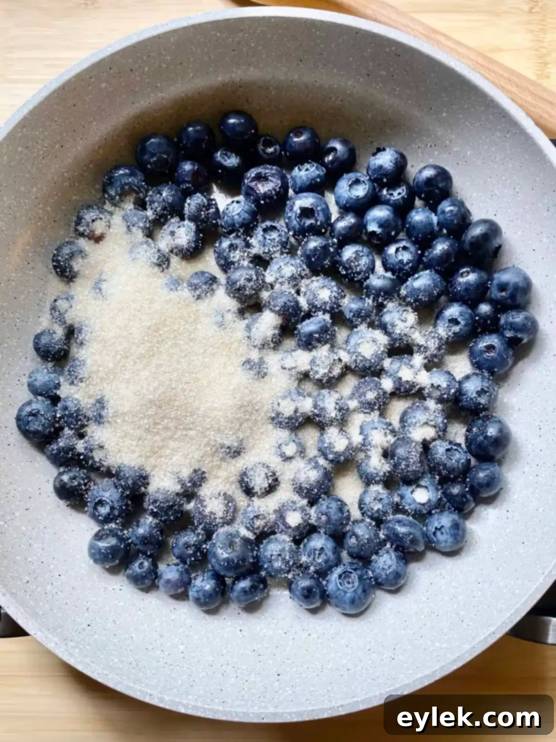 Blueberry sauce cooking on stove