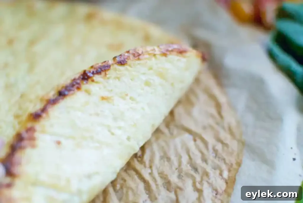 Another view of the pre-baked cauliflower crust, showcasing its firm texture.