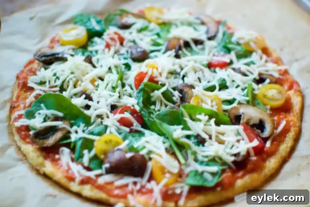 Close-up of the delicious toppings on the cauliflower crust pizza, ready for the final bake.