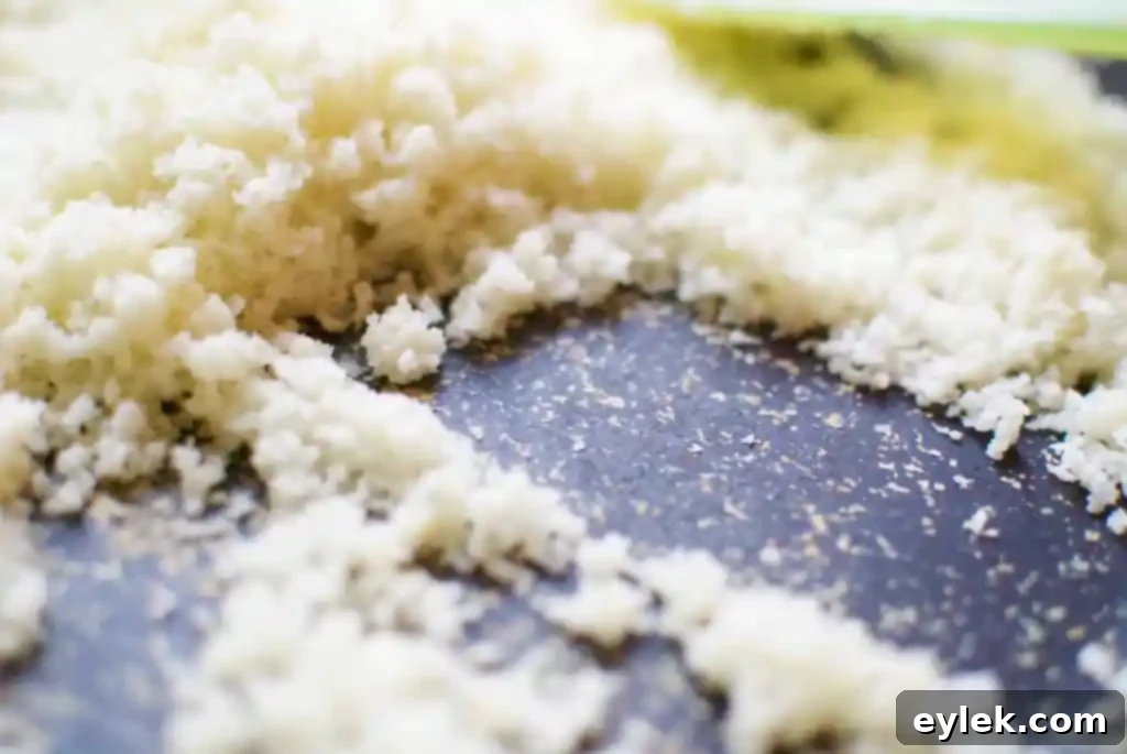 Close-up of finely processed cauliflower, ideal for a firm pizza crust.