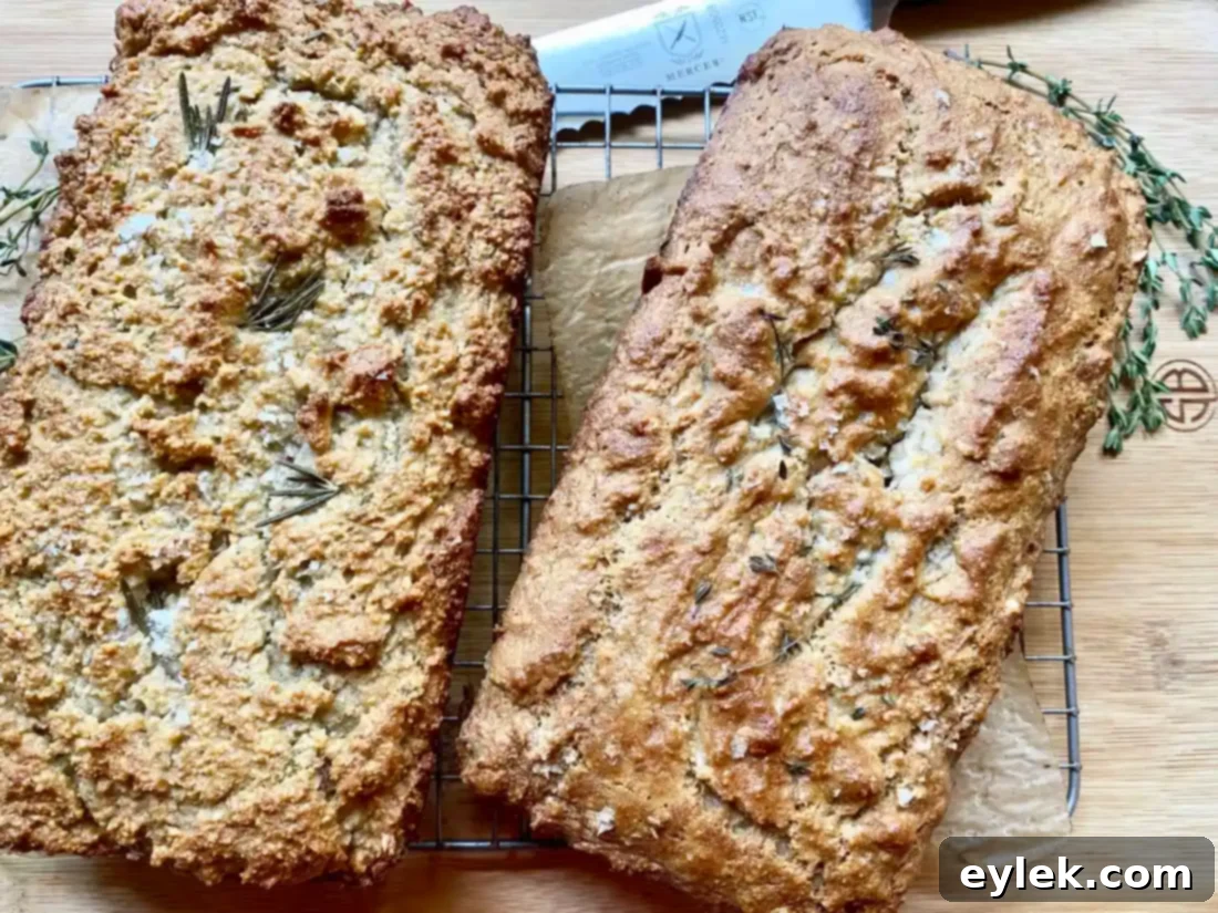 Freshly baked Rosemary & Thyme Almond Bread on a cooling rack
