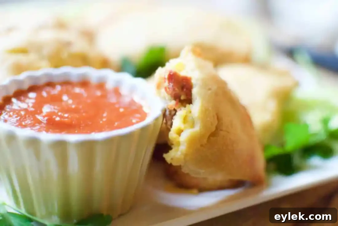 A pair of low-carb breakfast empanadas on a plate