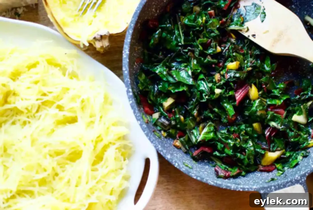Mixing spaghetti squash strands with the Aglio E Olio and chard sauce.