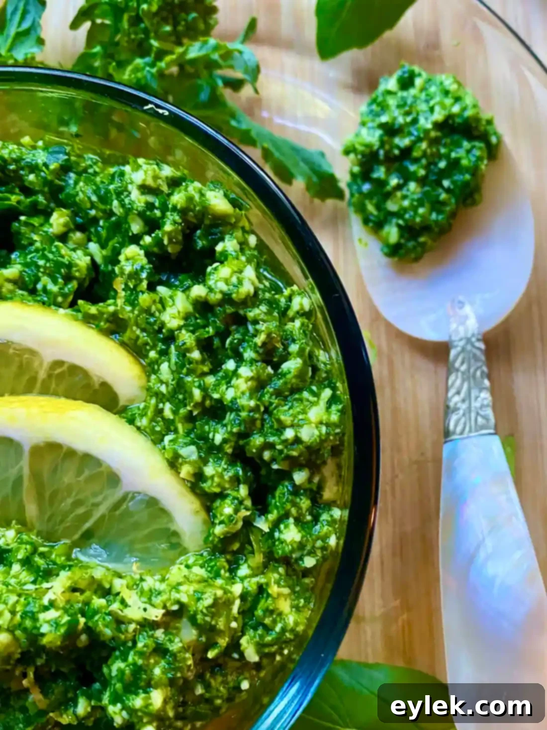 Broccoli Rabe & Lemon Pesto stored in a small container, topped with olive oil for freshness.