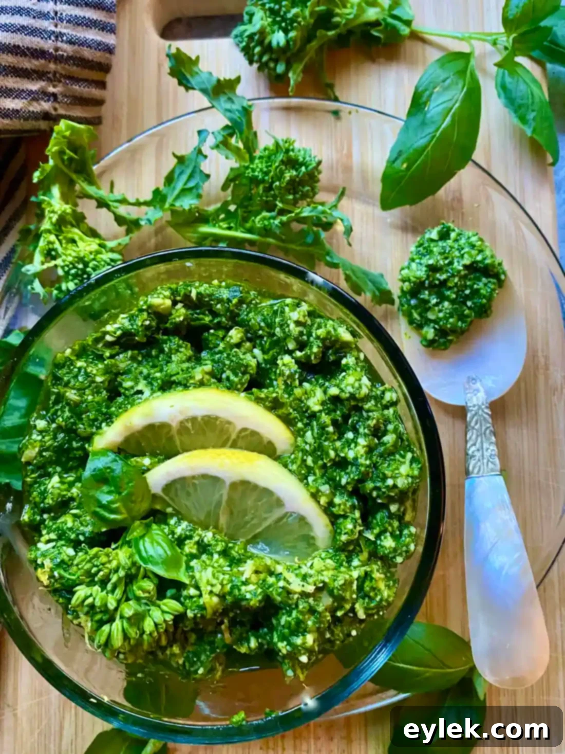 Broccoli Rabe & Lemon Pesto stored in a glass jar, ready for use or storage.