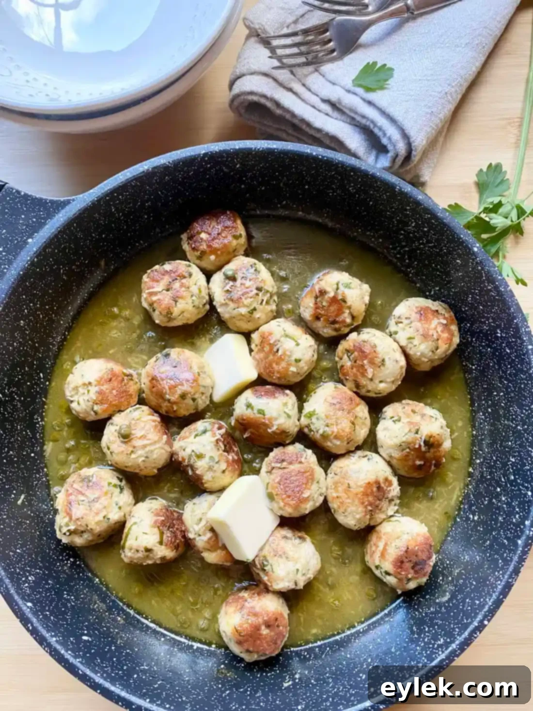 Zesty Chicken Piccata Meatballs 14 Adding butter to the piccata sauce