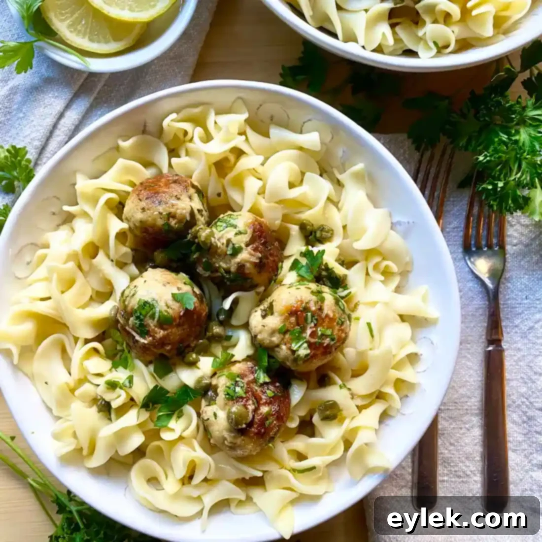 Lemony Chicken Piccata Meatballs garnished with parsley