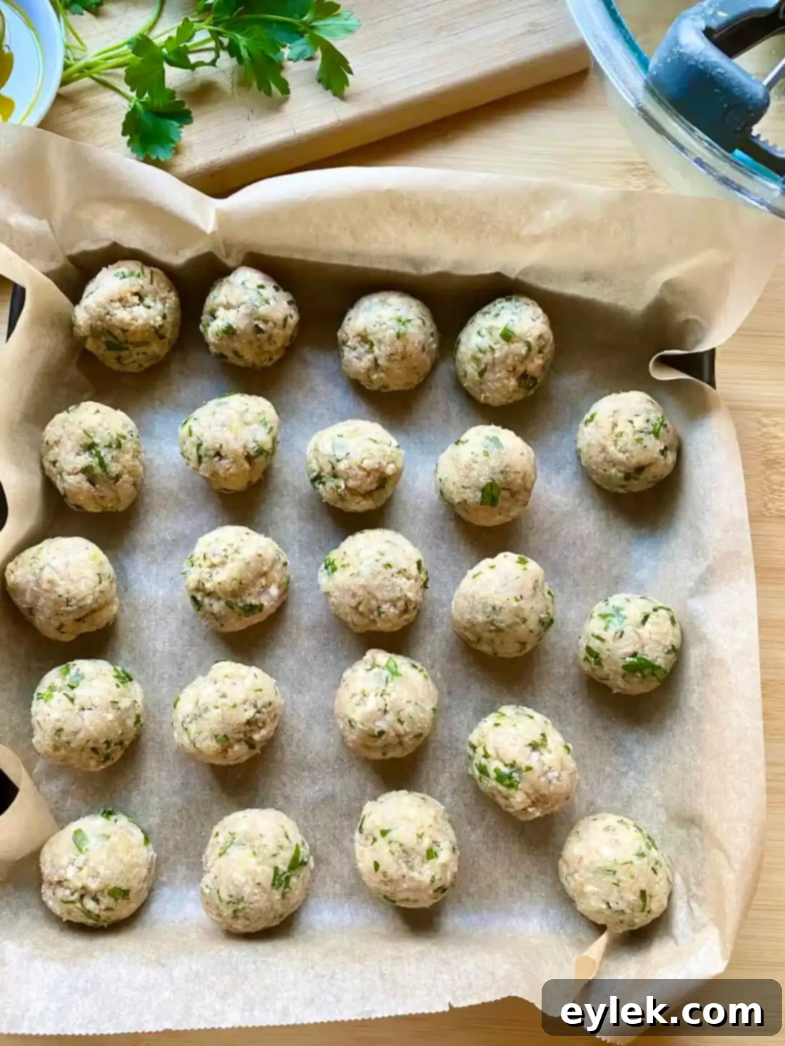 Browning chicken meatballs in a skillet