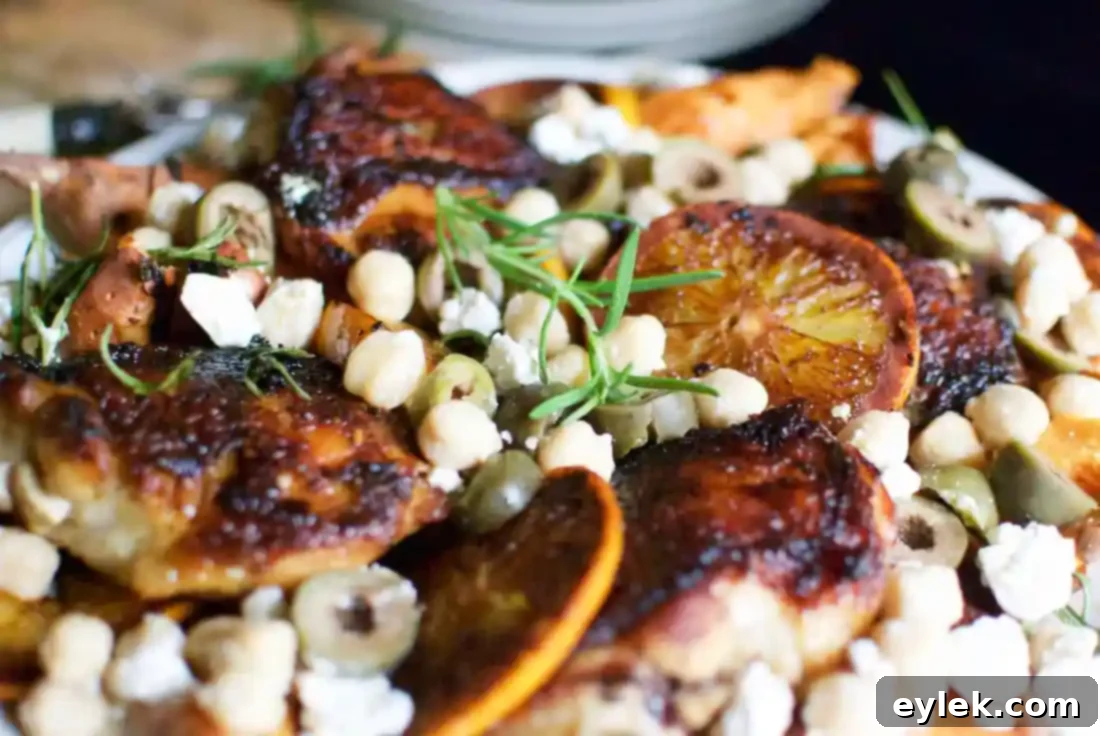 Overhead shot of the complete Charred Chicken with Sweet Potatoes & Oranges platter, showcasing the full meal