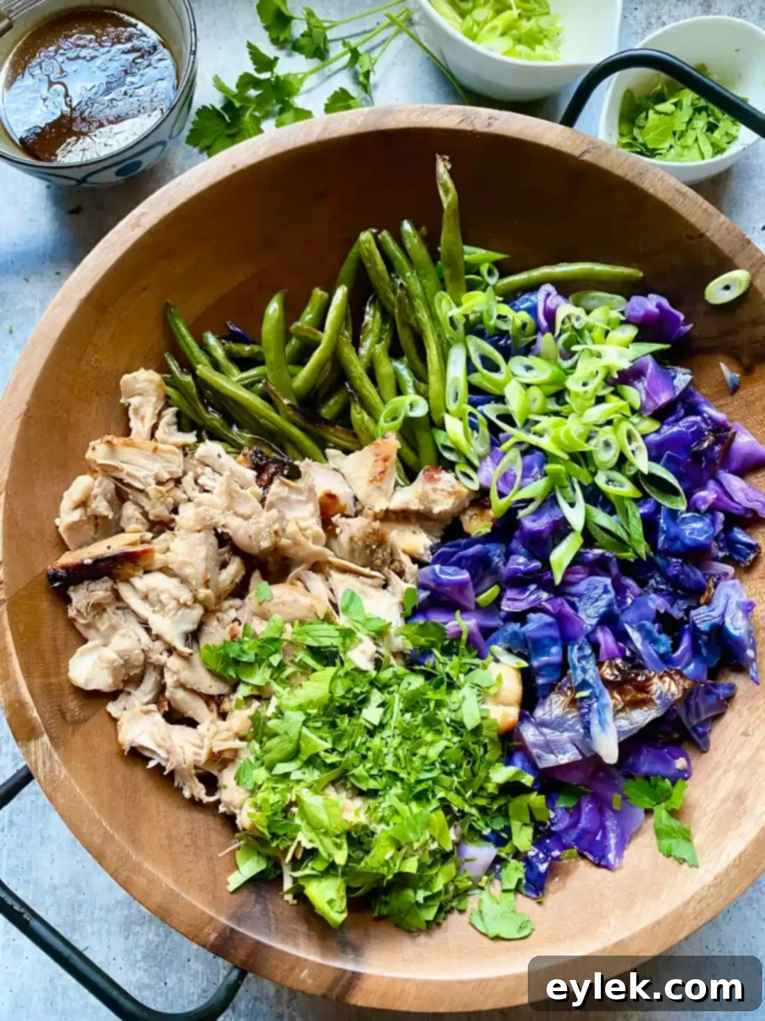 Crispy Sesame Chicken and Cabbage Salad 12 Tossing the sesame chicken and cabbage salad
