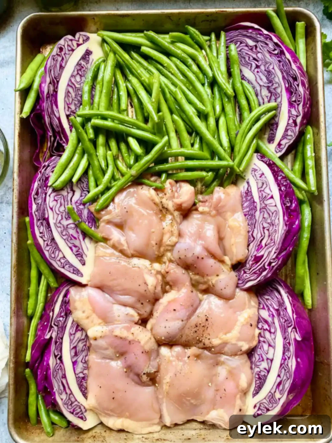 Crispy Sesame Chicken and Cabbage Salad 5 Red cabbage and green beans on baking sheet