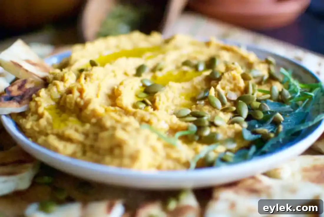 Pumpkin Hummus with Rosemary & Roasted Garlic served with warm naan bread and fresh vegetables