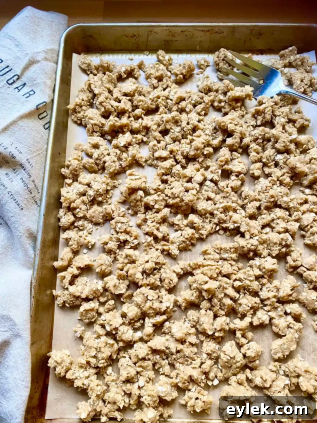 Streusel spread on baking sheet