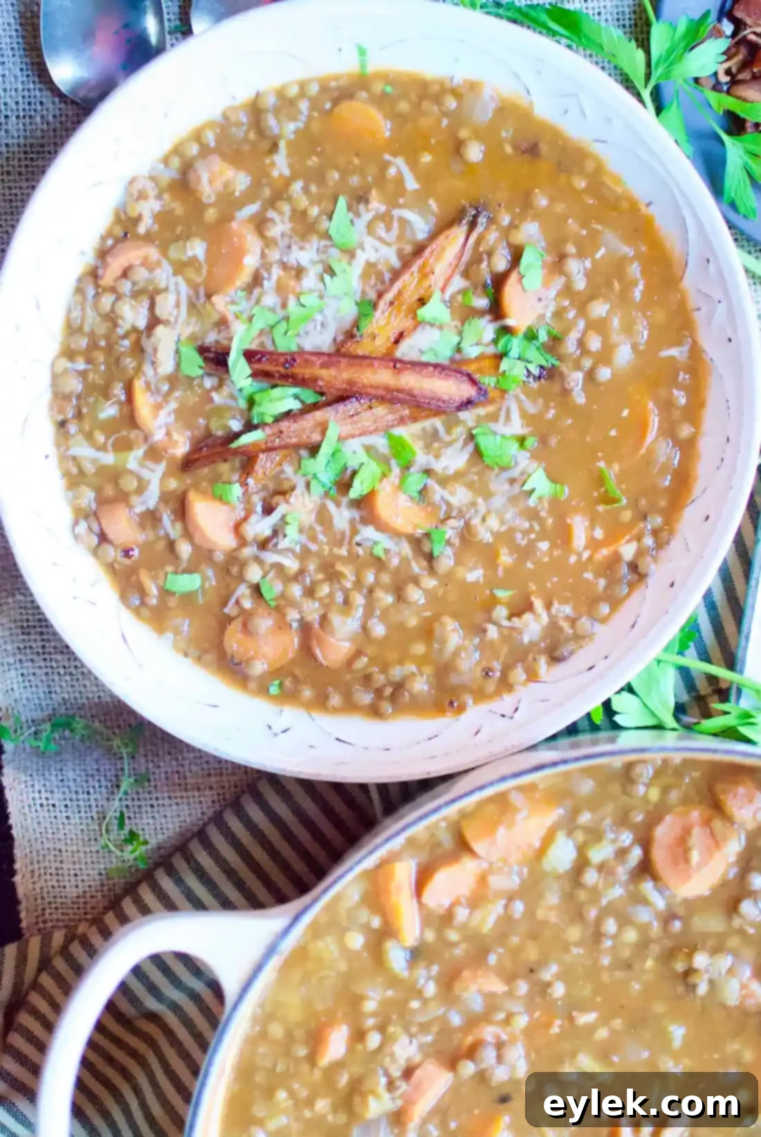 Ina Garten's Lentil and Sausage Soup 10 Ina Garten's Lentil & Sausage Soup is hearty and delicious with a generous supply of sausage and carrots throughout. And it’s naturally gluten-free. A Hint of Rosemary #soups #stew #stews #barefootcontessa #lentils #beans #carrots #glutenfree #heartysoups #ahintofrosemary