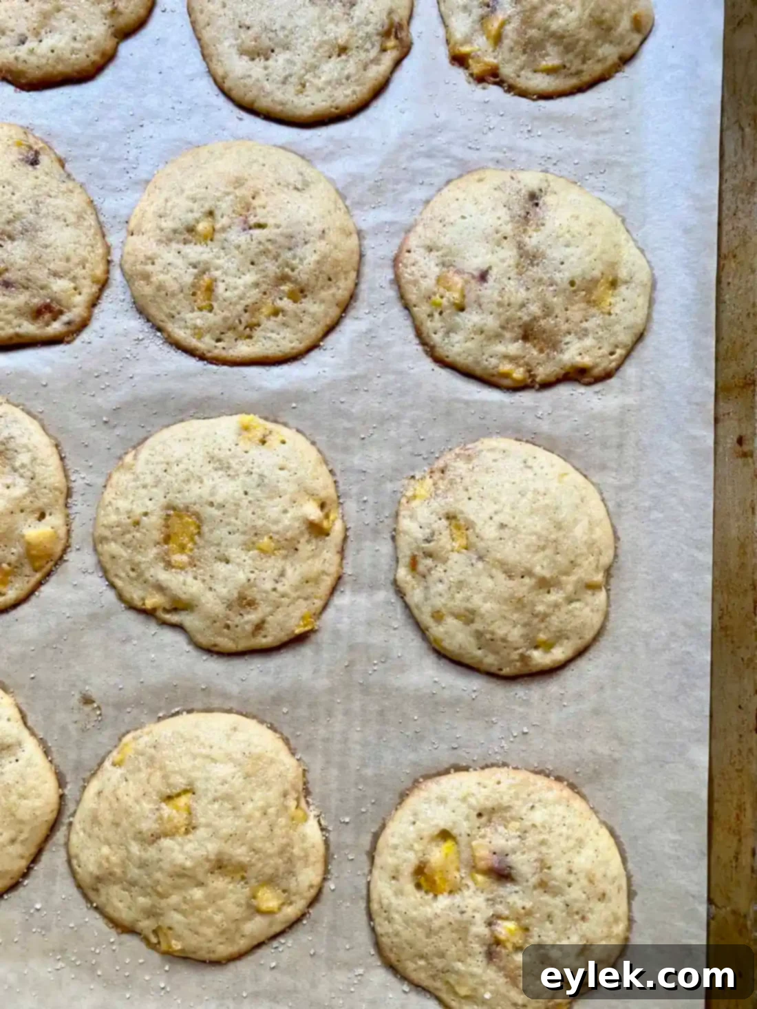 Cakey Peach Drop Cookies 12 Baked Peach Cake Drop Cookies on a cooling rack